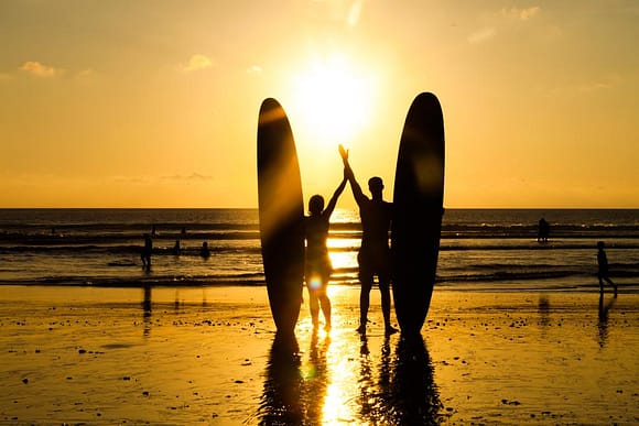 Beach surfers in Bali